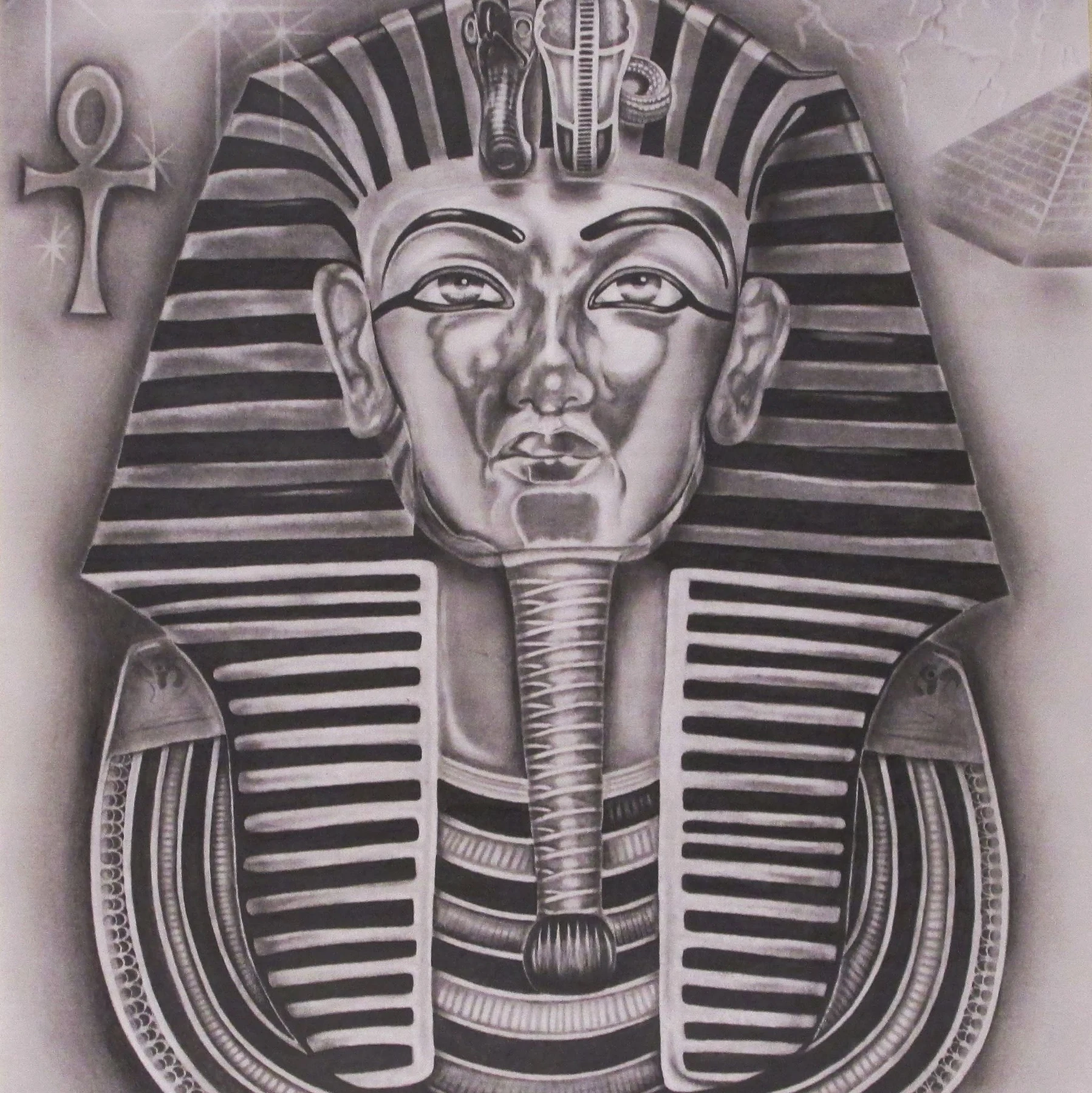 Detailed graphite study of the funerary mask of Tutankhamun with an ankh and pyramid motifs