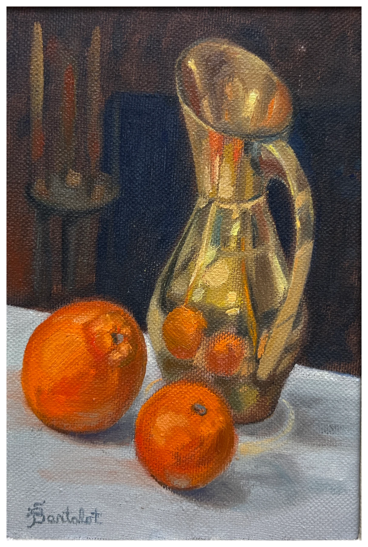 Oranges beside a glass pitcher in a still life by Sally Bartalot
